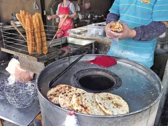 靠賣燒餅攢7套房